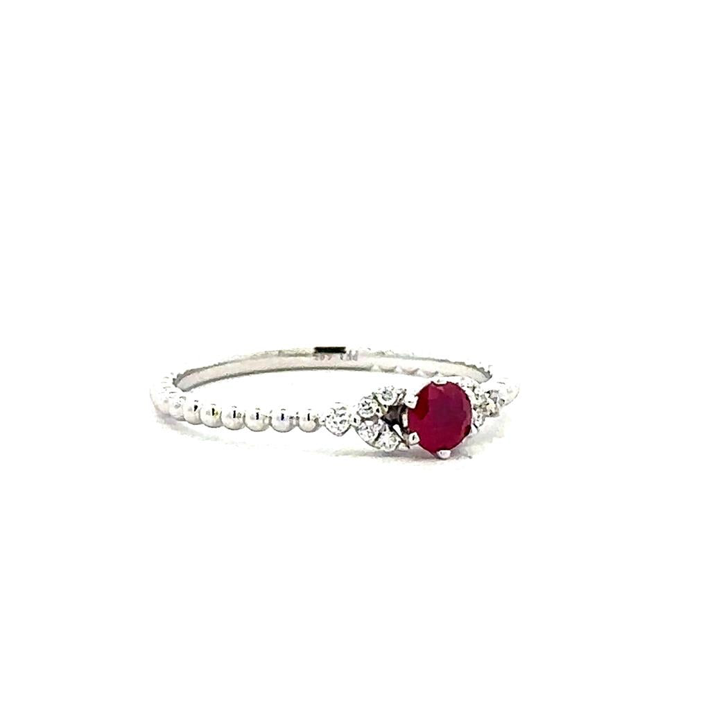 One 14kt white gold beaded ring set with one ruby 0.26ct weight and tw