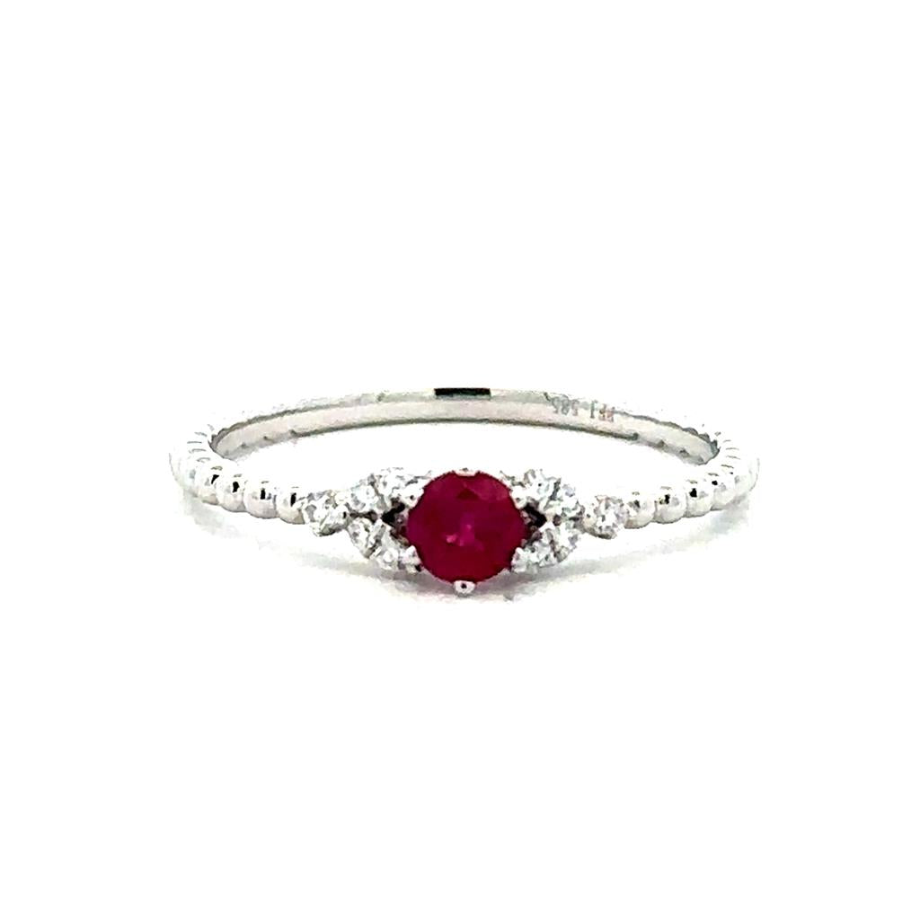 One 14kt white gold beaded ring set with one ruby 0.26ct weight and tw