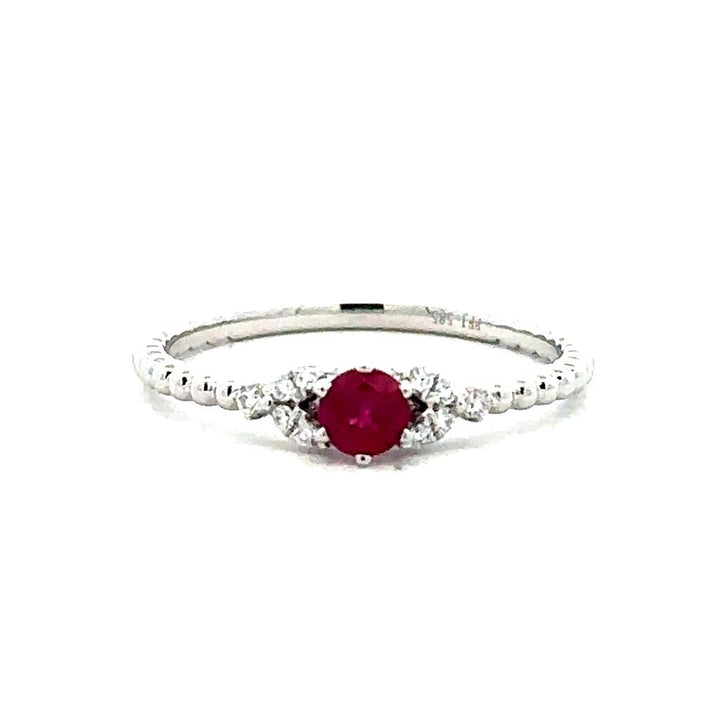 One 14kt white gold beaded ring set with one ruby 0.26ct weight and tw