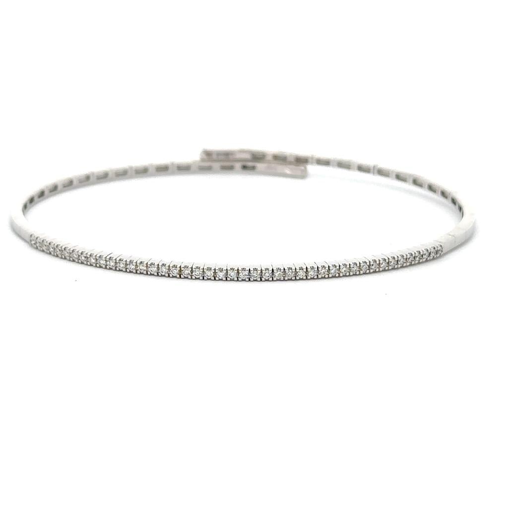 One 18K white gold flexible bangle with diamonds claw set across the t - Davidson's Jewellers
